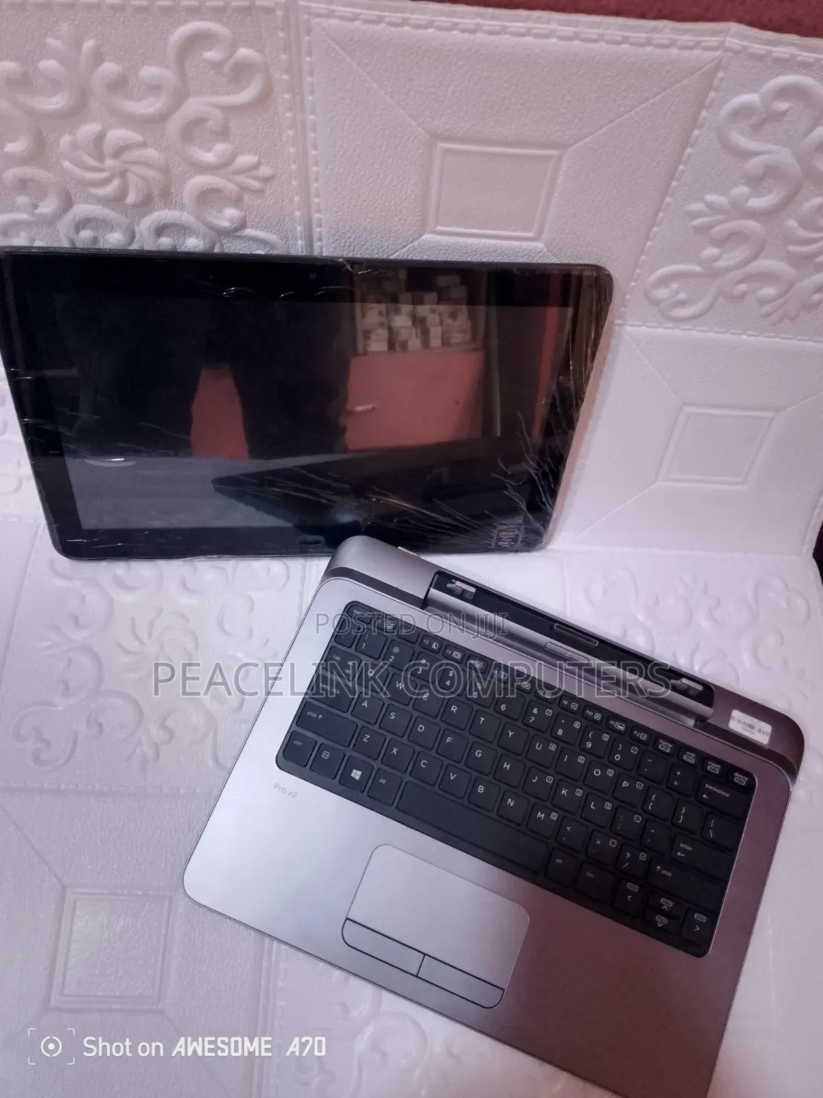 HP Pro x2 detachable laptop being serviced by a Peacelink Computers technician